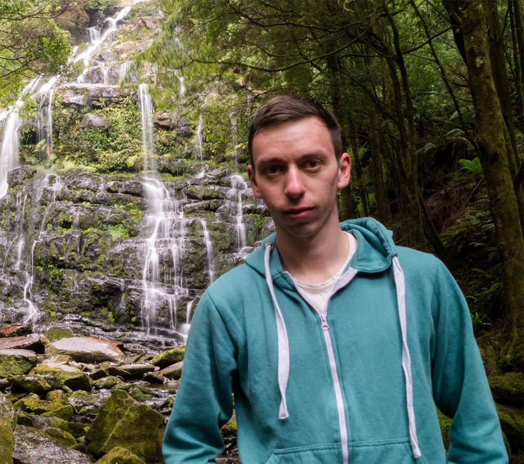 Marc at a waterfall in Tasmania